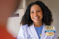Nurse Practitioner Desiree Robinson pictured next to the US News & World Report badge for 2026-2027
