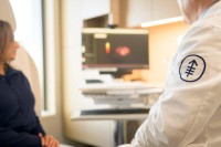 a doctor and patient review a scan