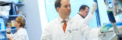 Gynecologic oncologist Douglas Levine in his lab .