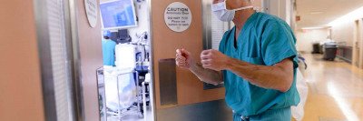 Surgeon Martin Weiser walks into operating room