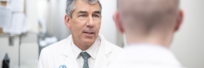 Urology Service Chief James Eastham talks to a patient