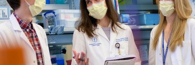 Scientists Jan Remsik, Adrienne Boire, and Jessica Wilcox in the lab 