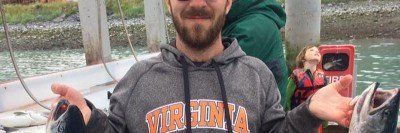 SKI immunologist Justin Perry holding a fish