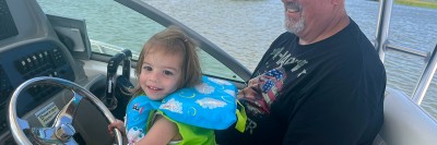Michael with his granddaughter on a boat