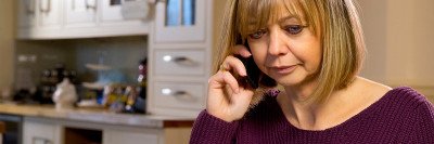 Woman on the phone discussing financial assistance options