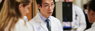 Jae Park, MD, of the Division of Hematologic Malignancies, with Department of Medicine fellows.