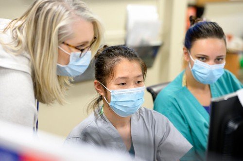 Three nurses wearing face masks