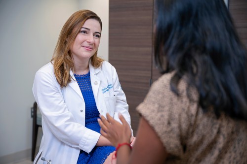 MSK medical oncologist, Dr. Maria Rubinstein, speaking with a patient.