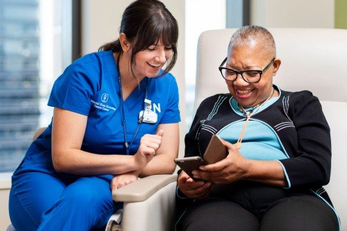 A nurse talks to a patient