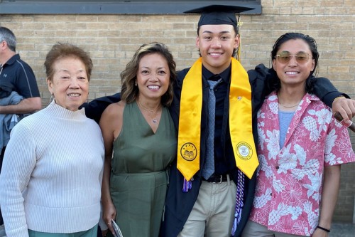 Two women and two young men at a high school graduation