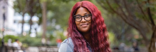 MSK patient Charisma McDuffie is seen smiling outdoors. 