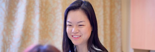 MSK breast medical oncologist Sherry Shen, MD, facing the camera and talking to a patient.