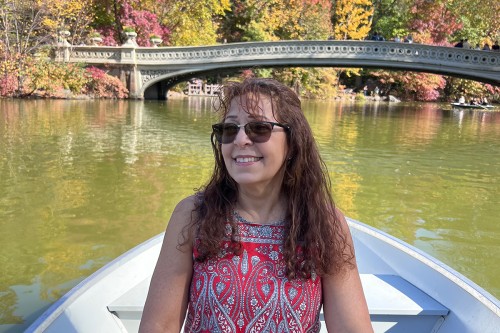 MSK patient Ellen Coopersmith smiling in a rowboat in Central Park