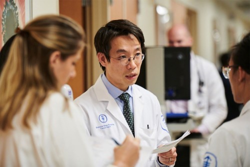Jae Park, MD, of the Division of Hematologic Malignancies, with Department of Medicine fellows.